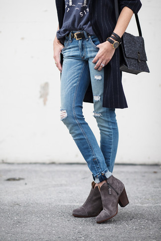 Charcoal Suede Ankle Boots Outfits: You're looking at the irrefutable proof that a navy vertical striped coat and blue ripped jeans look awesome when paired together in a relaxed outfit. Perk up your ensemble by wearing a pair of charcoal suede ankle boots.