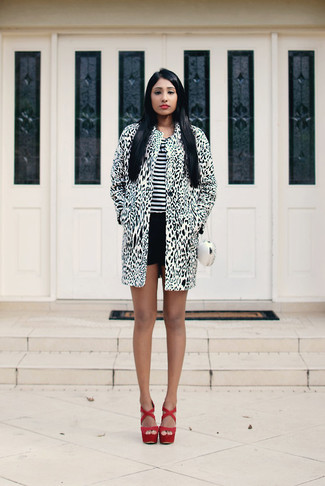 White Clutch Outfits: The go-to for kick-ass laid-back style? A white and black leopard coat with a white clutch. Inject your outfit with an added dose of style with a pair of red suede wedge sandals.