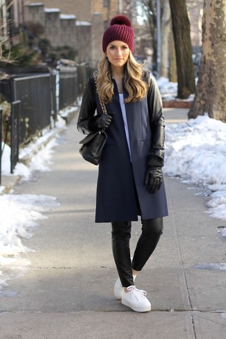 Black Leather Coat Outfits For Women: As you can see here, looking elegant doesn't require that much effort. Opt for a black leather coat and black leather skinny pants and be sure you'll look stylish. Go ahead and complete your ensemble with white leather low top sneakers for a more relaxed touch.