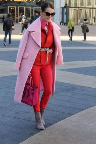 Pink Fluffy Crew-neck Sweater Outfits For Women: Display your expert styling by marrying a pink fluffy crew-neck sweater and red skinny pants for an off-duty combination. To bring some extra definition to your ensemble, complete this outfit with grey suede ankle boots.