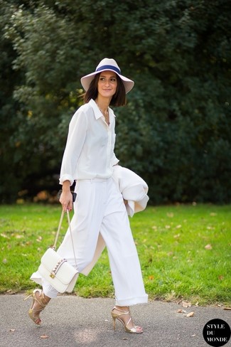 Pink Wool Hat Outfits For Women: Want to inject your wardrobe with some edgy chic? Dress in a white coat and a pink wool hat. Gold leather heeled sandals will infuse an added touch of polish into an otherwise utilitarian ensemble.
