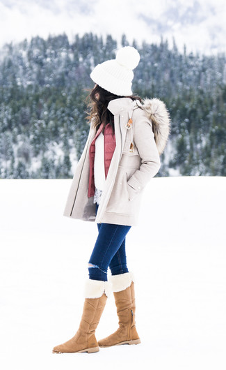 Boots Outfits For Women: This combo of a beige coat and navy ripped skinny jeans is devastatingly stylish and yet it looks relaxed and ready for anything. And if you need to effortlessly dial down your getup with a pair of shoes, introduce a pair of boots to the mix.