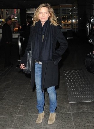 Michelle Pfeiffer wearing Black Coat, Blue Jeans, Beige Suede Ankle Boots, Black Leather Tote Bag