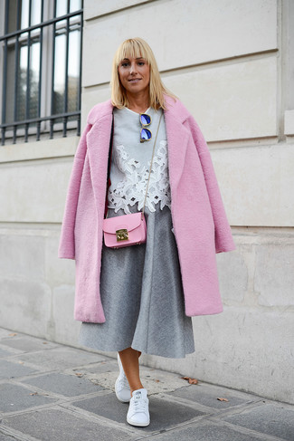 Midi Skirt Outfits: This totaly stylish outfit is really pared down: a pink coat and a midi skirt. A trendy pair of white leather low top sneakers is an effortless way to punch up your look.