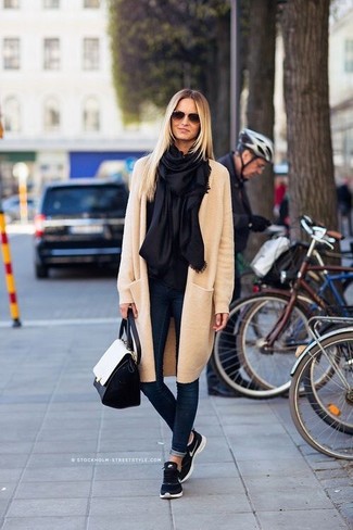 Women's Beige Coat, Navy Skinny Jeans, Navy Athletic Shoes, Black and White Leather Satchel Bag
