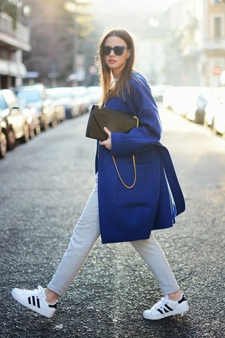 Women's Blue Coat, Grey Skinny Pants, White and Black Low Top Sneakers, Black Leather Clutch
