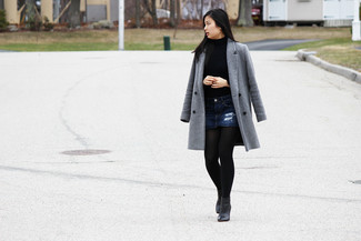Black Leather Ankle Boots Outfits: For a look that's super easy but can be flaunted in many different ways, wear a grey coat with a navy denim mini skirt. If you want to effortlessly up the style ante of your outfit with a pair of shoes, introduce a pair of black leather ankle boots to the mix.