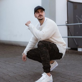 White Crew-neck Sweater Casual Outfits For Men: Consider wearing a white crew-neck sweater and dark green camouflage cargo pants for a functional outfit that's also well put together. A pair of beige canvas low top sneakers integrates really well within many outfits.