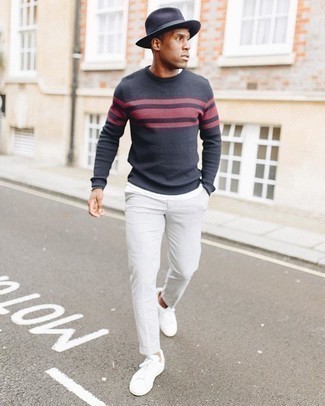 Navy Crew-neck Sweater Spring Outfits For Men: Why not pair a navy crew-neck sweater with grey chinos? As well as very comfortable, these two pieces look awesome when paired together. Finishing with white canvas low top sneakers is a fail-safe way to inject a mellow feel into this look. So if you're looking for an ensemble that's stylish but also entirely spring-friendly, this one fits the task well.