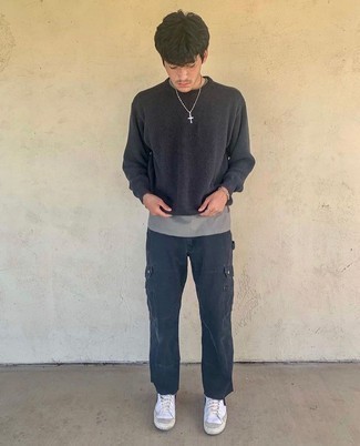Cargo Pants Outfits: To put together a casual look with a modernized spin, you can easily rock a black crew-neck sweater and cargo pants. And if you wish to easily play down this look with one piece, add a pair of white and black leather high top sneakers to your look.