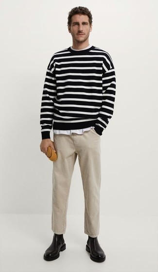 Black and White Horizontal Striped Crew-neck Sweater Outfits For Men: Wear a black and white horizontal striped crew-neck sweater with beige corduroy chinos for a laid-back and fashionable outfit. If you need to effortlessly ramp up this outfit with one single piece, add a pair of black leather chelsea boots to your ensemble.