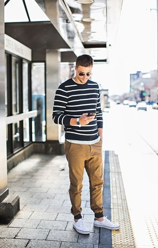 Black Horizontal Striped Crew-neck Sweater Outfits For Men: When the situation permits casual style, marry a black horizontal striped crew-neck sweater with khaki chinos. White canvas low top sneakers will be the perfect addition for your outfit.