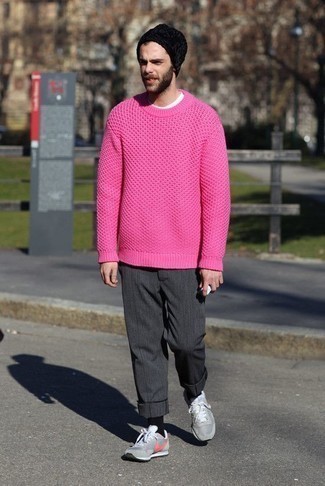 Hot Pink Crew-neck Sweater Outfits For Men: Reach for a hot pink crew-neck sweater and charcoal chinos to show off your styling smarts. On the shoe front, go for something on the laid-back end of the spectrum and finish this ensemble with grey athletic shoes.