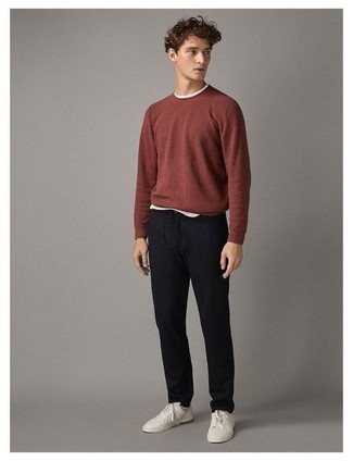 Tobacco Crew-neck Sweater Outfits For Men: Consider teaming a tobacco crew-neck sweater with navy chinos to put together a casual and cool getup. When this getup is too much, dress it down by wearing a pair of white canvas low top sneakers.