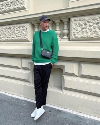Black Leather Messenger Bag Outfits: A green crew-neck sweater and a black leather messenger bag are a modern casual combination that every sartorially savvy man should have in his menswear collection. Complete your look with white leather low top sneakers to make the ensemble a bit more elegant.