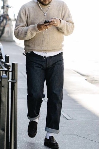 Beige Crew-neck Sweater Outfits For Men: For a laid-back look, consider wearing a beige crew-neck sweater and charcoal jeans — these pieces work really well together. Clueless about how to complement this look? Finish off with a pair of black leather loafers to dial up the style factor.