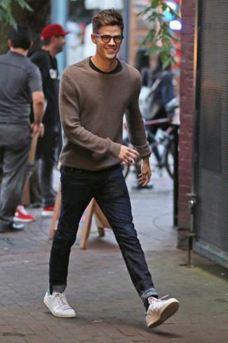 Brown Crew-neck Sweater Outfits For Men: A brown crew-neck sweater looks so great when worn with navy jeans in a casual outfit. When not sure about the footwear, complement this outfit with a pair of white and green leather low top sneakers.
