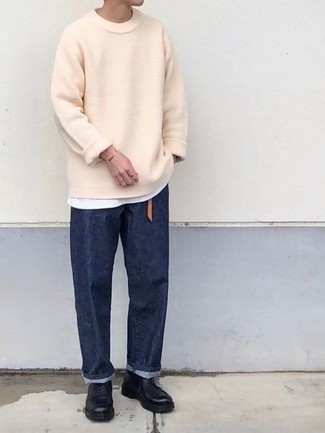 Tan Crew-neck Sweater Outfits For Men: This combo of a tan crew-neck sweater and navy jeans is perfect for off-duty settings. And if you wish to immediately rev up this outfit with one piece, introduce a pair of black leather casual boots to the equation.
