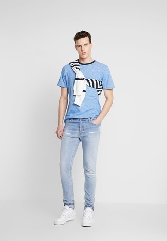 Light Blue Crew-neck T-shirt Outfits For Men: A light blue crew-neck t-shirt and light blue ripped jeans are awesome menswear essentials to have in your daily wardrobe. A cool pair of white leather low top sneakers is the most effective way to inject a touch of elegance into this ensemble.