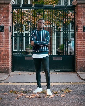 Navy Vertical Striped Crew-neck Sweater Outfits For Men: Get into zen mode in this comfortable pairing of a navy vertical striped crew-neck sweater and charcoal ripped skinny jeans. White canvas low top sneakers are an effortless way to power up your outfit.