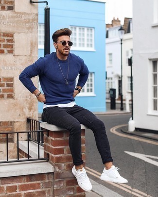 Black and White Skinny Jeans Outfits For Men: A navy crew-neck sweater and black and white skinny jeans are both versatile menswear staples that will integrate well within your daily outfit choices. A pair of white athletic shoes easily kicks up the street cred of this outfit.