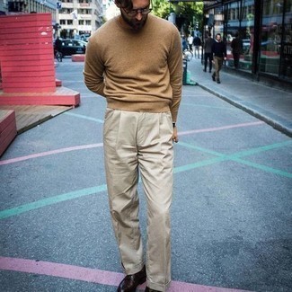 Beige Dress Pants Outfits For Men: For a look that's elegant and totally envy-worthy, wear a tan crew-neck sweater with beige dress pants. This look is rounded off perfectly with dark brown leather derby shoes.