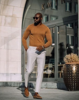 Tobacco Crew-neck Sweater Outfits For Men: If the dress code calls for a refined yet kick-ass look, go for a tobacco crew-neck sweater and white vertical striped dress pants. You know how to inject a touch of polish into this outfit: tobacco suede loafers.