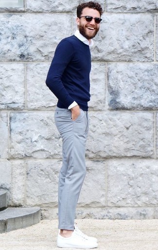 Aquamarine Chinos Outfits: A navy crew-neck sweater and aquamarine chinos are the kind of a winning casual ensemble that you need when you have zero time to spare. Go ahead and complement your outfit with a pair of white leather low top sneakers for an air of stylish effortlessness.