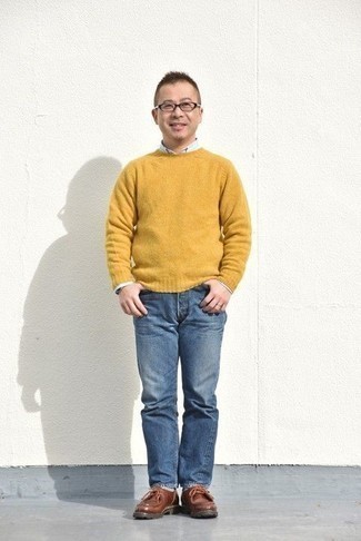 Mustard Crew-neck Sweater Outfits For Men: This pairing of a mustard crew-neck sweater and blue jeans is impeccably stylish and yet it looks laid-back enough and ready for anything. When not sure about what to wear in the shoe department, go with brown leather desert boots.