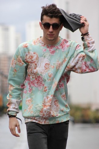 Mint Floral Crew-neck Sweater Outfits For Men: This combo of a mint floral crew-neck sweater and charcoal jeans is solid proof that a simple casual ensemble can still be really interesting.