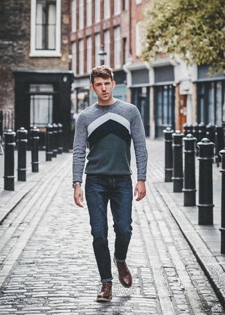 Why not team a grey print crew-neck sweater with navy jeans? Both of these items are very comfortable and look amazing paired together. Amp up the classiness of this ensemble a bit by sporting a pair of burgundy leather desert boots.
