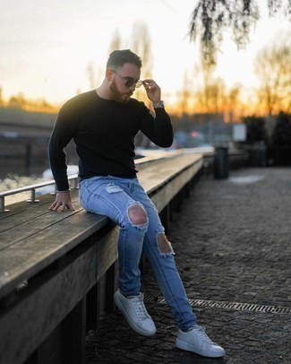 Navy Crew-neck Sweater Relaxed Outfits For Men: Marry a navy crew-neck sweater with light blue ripped jeans for equally dapper and easy-to-wear ensemble. Our favorite of a ton of ways to finish this ensemble is with white leather low top sneakers.