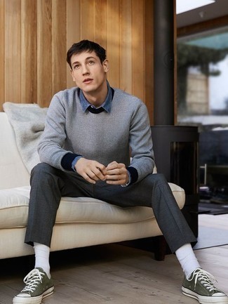 Crew-neck Sweater Outfits For Men: Marry a crew-neck sweater with charcoal chinos to achieve a casually stylish getup. Give a dressed-down twist to your ensemble by rounding off with a pair of olive canvas low top sneakers.