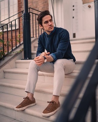 Brown Suede Low Top Sneakers Outfits For Men: You're looking at the hard proof that a navy crew-neck sweater and beige chinos look amazing when you pair them up in a laid-back outfit. Complete this look with brown suede low top sneakers to make the getup more fun.