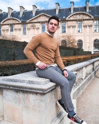 Beige Crew-neck Sweater Casual Outfits For Men: Marry a beige crew-neck sweater with grey plaid chinos for a casual and cool and trendy outfit. Our favorite of an infinite number of ways to complement this look is black print canvas low top sneakers.