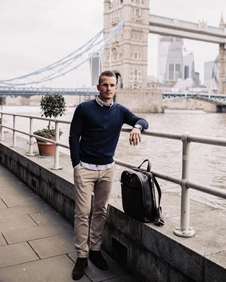 Beige Chinos Smart Casual Outfits: This casual combination of a navy crew-neck sweater and beige chinos comes to rescue when you need to look laid-back and cool but have zero time to spare. Don't know how to complement this outfit? Rock dark brown suede chelsea boots to kick it up.