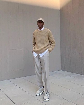 Beige Crew-neck Sweater Spring Outfits For Men: Marry a beige crew-neck sweater with beige dress pants for truly classic attire. Ramp up the style factor of your getup by finishing with a pair of grey athletic shoes. So so as you can see, it's a neat, not to mention season-appropriate, outfit to have in your transitional arsenal.