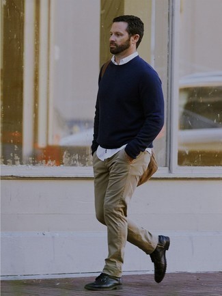 Navy Crew-neck Sweater Outfits For Men: This casual combination of a navy crew-neck sweater and beige jeans is perfect when you want to feel confident in your getup. Rounding off with black leather casual boots is the simplest way to introduce some extra depth to this ensemble.