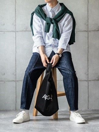 Black Canvas Tote Bag Outfits For Men: Marrying a dark green crew-neck sweater with a black canvas tote bag is an awesome choice for a casually cool ensemble. Take your look a more elegant path by rounding off with white canvas low top sneakers.