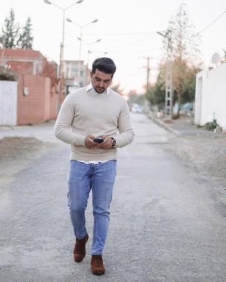 Beige Crew-neck Sweater Outfits For Men: A beige crew-neck sweater and light blue jeans will bring serious style to your day-to-day casual rotation. Inject your ensemble with a dash of polish by finishing with a pair of dark brown suede chelsea boots.