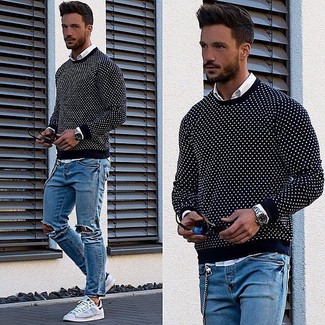 Navy Polka Dot Crew-neck Sweater Outfits For Men: If you're all about feeling relaxed when it comes to fashion, this combo of a navy polka dot crew-neck sweater and blue ripped skinny jeans is totally you. For something more on the sophisticated end to round off this look, complement your outfit with grey low top sneakers.
