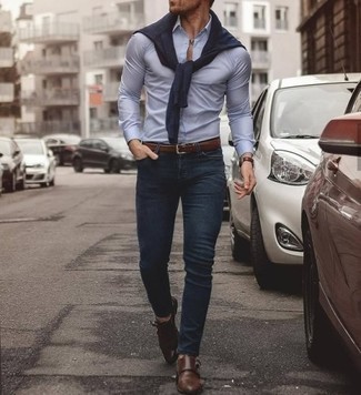 Brown Leather Watch Outfits For Men: This combination of a navy crew-neck sweater and a brown leather watch is proof that a pared down off-duty look can still look really interesting. Feeling transgressive? Spice things up by finishing with a pair of brown leather double monks.