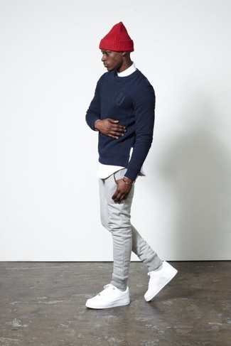 Blue Print Crew-neck Sweater Outfits For Men: A blue print crew-neck sweater and grey sweatpants are must-have staples if you're crafting an off-duty wardrobe that holds to the highest menswear standards. To add more class to your ensemble, finish with a pair of white low top sneakers.