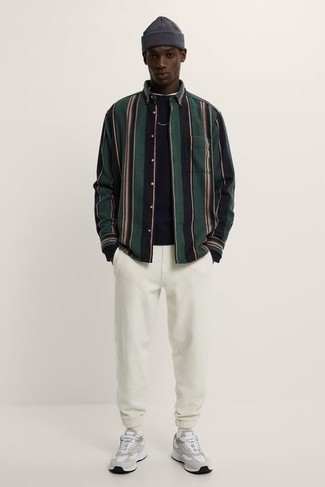 Dark Green Vertical Striped Long Sleeve Shirt Outfits For Men: A dark green vertical striped long sleeve shirt and white sweatpants will add extra dapperness to your day-to-day casual fashion mix. Loosen things up and add grey athletic shoes to the equation.