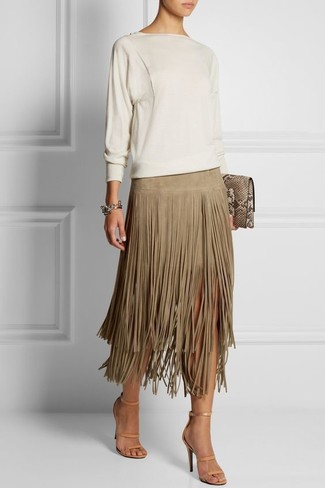 Beige Fringe Midi Skirt Outfits: A white crew-neck sweater and a beige fringe midi skirt are bona fide must-haves if you're picking out an off-duty closet that matches up to the highest sartorial standards. For something more on the sophisticated end to complete this outfit, complete this look with beige leather heeled sandals.