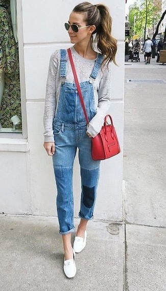 White Leather Loafers Outfits For Women: If you're all about relaxed dressing when it comes to fashion, you'll love this absolutely chic pairing of a grey crew-neck sweater and blue denim overalls. For extra style points, complement this outfit with white leather loafers.