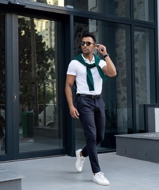 Polo Outfits For Men: A seriously stylish combo of a polo and navy chinos will bring confidence and make you feel good about yourself. If you're clueless about how to finish, introduce a pair of white leather low top sneakers to the equation.