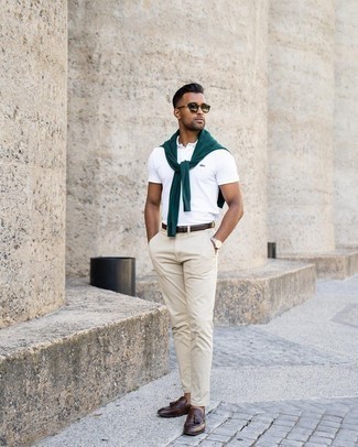 Silver Sunglasses Outfits For Men: Marrying a dark green crew-neck sweater with silver sunglasses is a wonderful choice for a laid-back and cool look. Finishing with dark brown leather tassel loafers is a fail-safe way to infuse an added dose of style into your outfit.