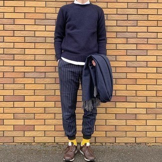 Blue Vertical Striped Chinos Outfits: A navy crew-neck sweater and blue vertical striped chinos are a good combo to keep in your wardrobe. Give a more relaxed twist to your getup by sporting a pair of dark brown athletic shoes.