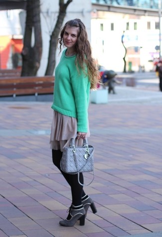 Grey Suede Ankle Boots Outfits: Make a mint crew-neck sweater and a beige skater skirt your outfit choice for a cool-girl vibe. And it's a wonder how grey suede ankle boots can lift up a look.